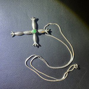 Large silver Cross with turquoise stone.